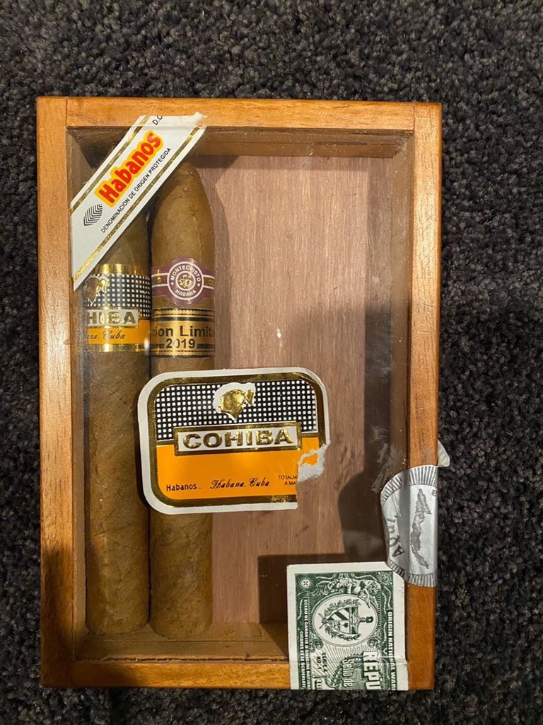 A glass-top box of fake Cohibas.